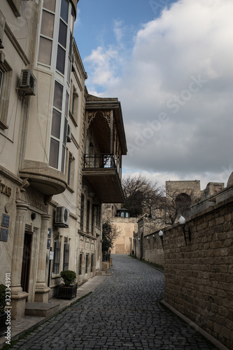 Fototapeta Naklejka Na Ścianę i Meble -  Empty street in old city of Baku, Azerbaijan. Old city Baku. Inner City buildings.