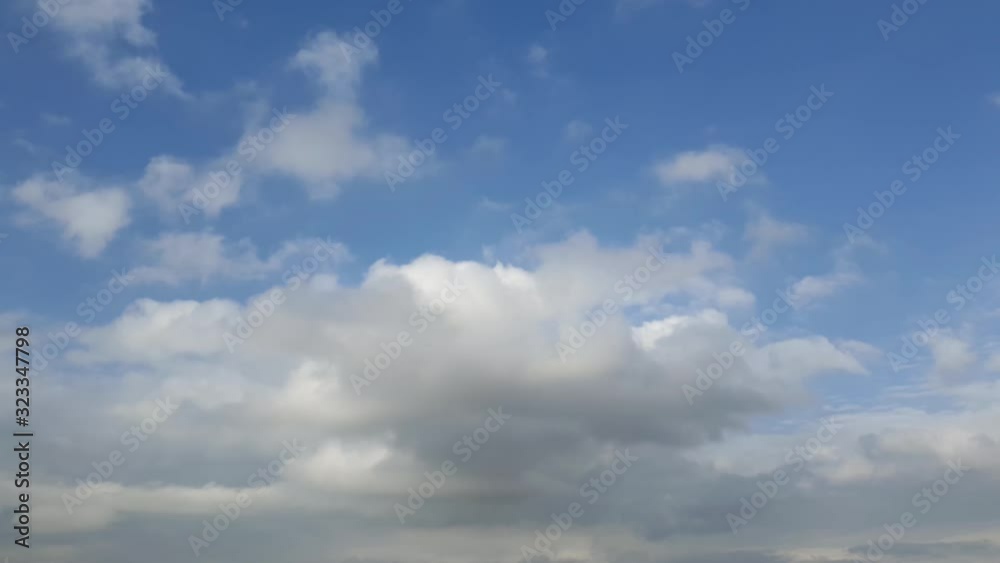Mid afternoon thunderstorm rain clouds forming and blending across the african horizon  time lapse, noise free 4k footage.