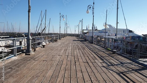 Larnacas Marina Port Finikoudes Cyprus. January 2020 Beautiful Larnaka Marina Deck, Cyprus in a sunny weather.  photo