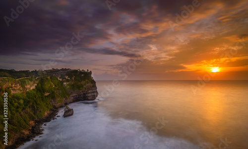 A view of Idian Ocean from Bali, Indonesia. Beautiful blue ocean water and a hanging cliff by the sea