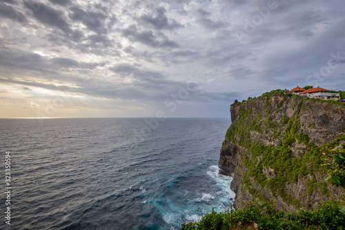 A view of Idian Ocean from Bali, Indonesia. Beautiful blue ocean water and a hanging cliff by the sea