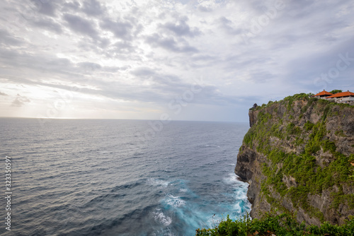 A view of Idian Ocean from Bali  Indonesia. Beautiful blue ocean water and a hanging cliff by the sea