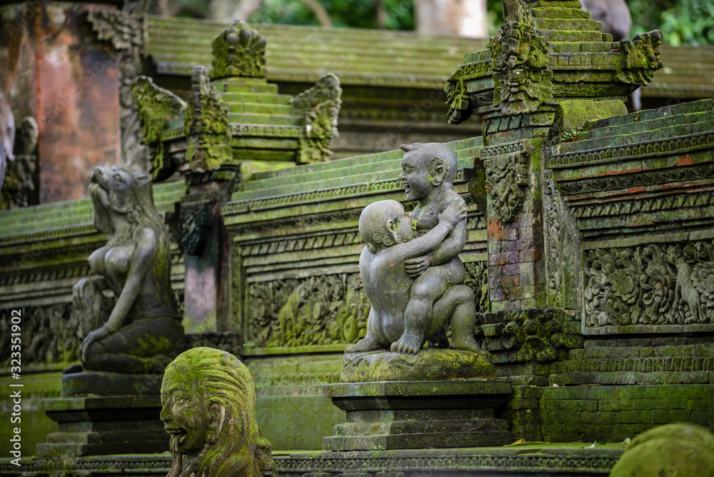 Balinese sculptures and architectural details in a temple, antique and rich of local culture
