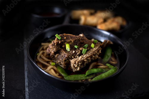 Asian Broth Soup with Udon Noodles and Egg Rolls