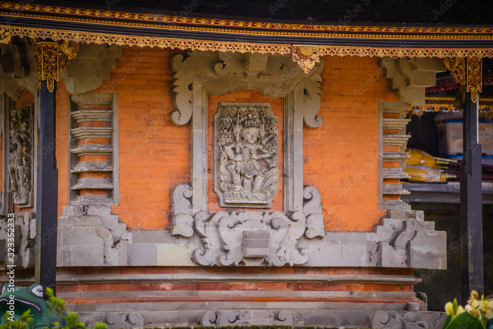 Fototapeta premium Balinese sculptures and traditional architectural details in a temple in Bali, Indonesia
