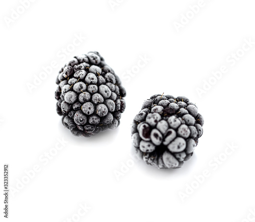 Frozen blackberries isolated on white background