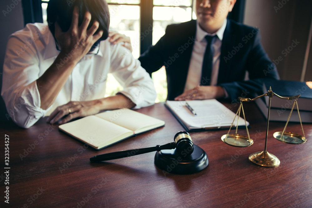 © wutzkoh - Lawyer is encouraging the client who estimates the trial and may not win the case in the office. © wutzkoh - Lawyer is encouraging the client who estimates the trial and may not win the case in the office.