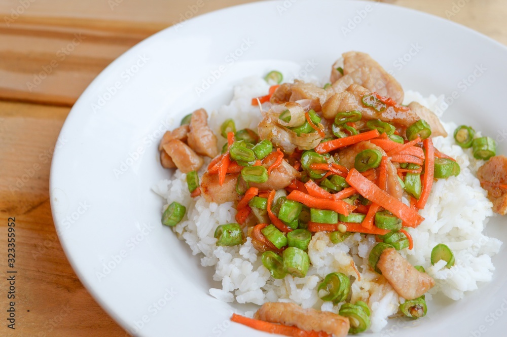 pork and vegetable fried on hot rice - Thailand healthy food