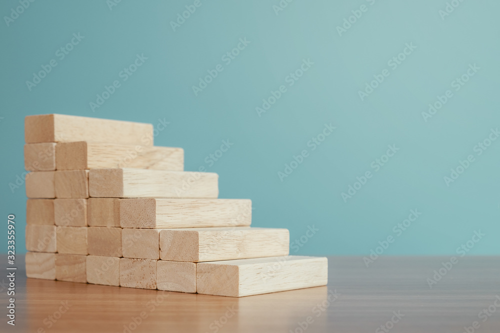 Business concept of ladder career path and growth success process. Wood cube block stacking as step stair. Business concept of ladder career path and growth success process. Wood cube block stacking as step stair.