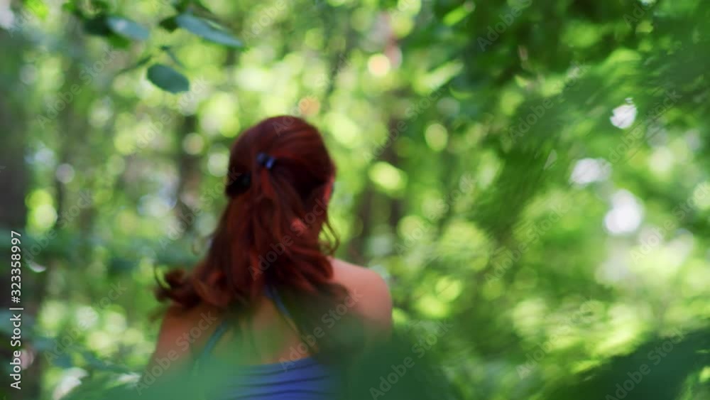 Woman running jogging in the wood, forest, 4k slow motion Woman running jogging in the wood, forest, 4k slow motion