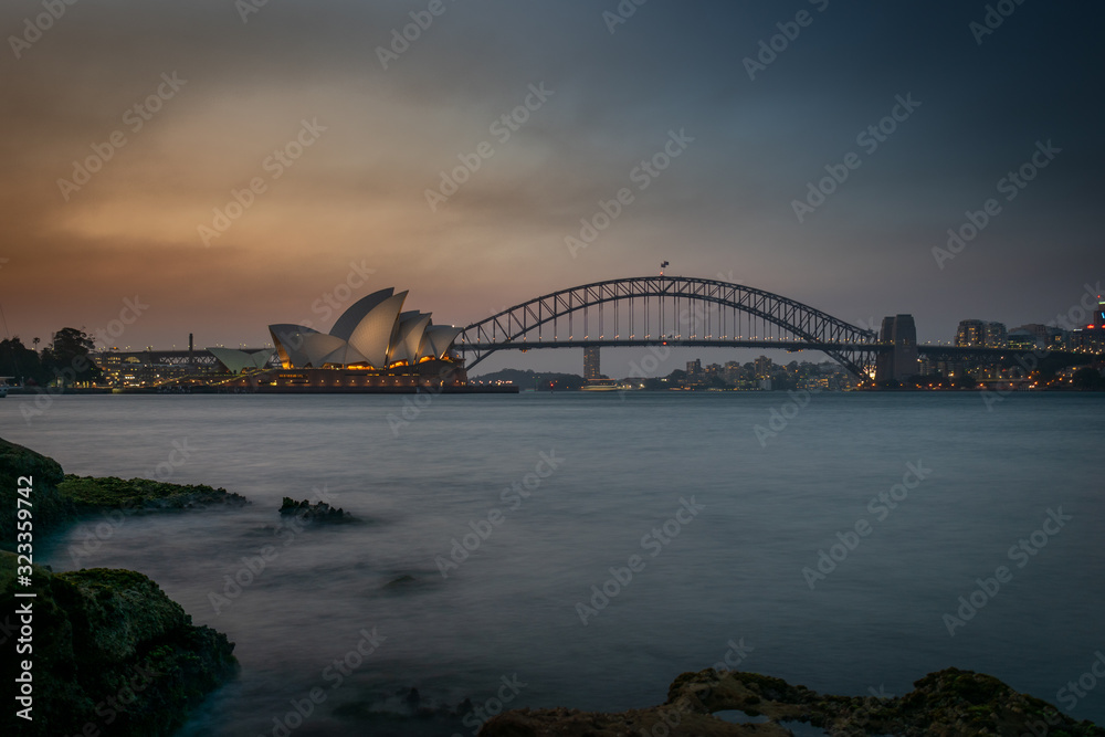 Naklejka premium sydney harbour bridge at sunset