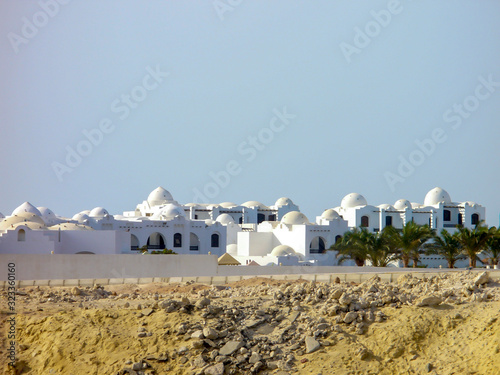Egyptian landscapes of the desert, Nile and Arab buildings. Travel concept.