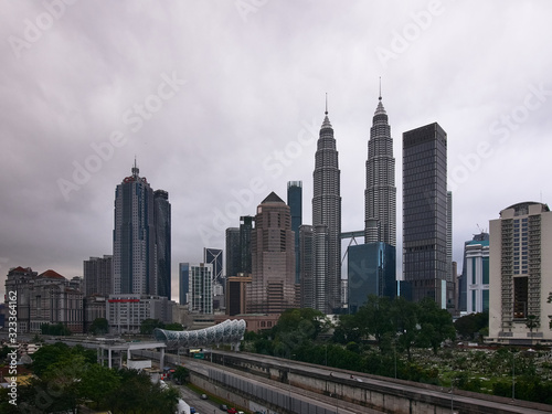 A view of the Kuala Lumpur skyline with cloudy weather.