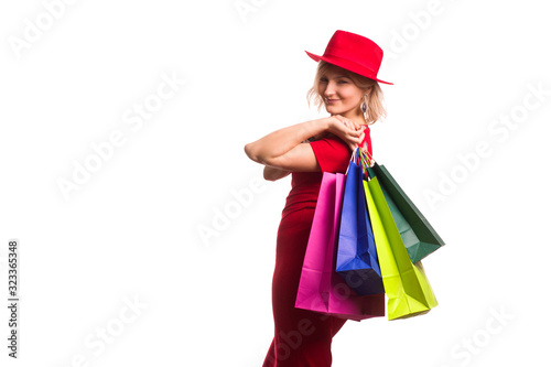 blonde girl in a red dress with Shopping Bags. Sales