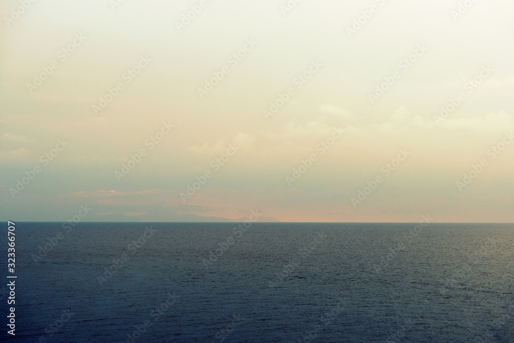 Morning seascape near Cefalu town on the Sicily, Italy. Natural toned background Morning seascape near Cefalu town on the Sicily, Italy. Natural toned background