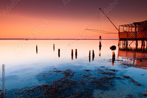 Pialassa della Baiona, Marina Romea, Ravenna, Emilia Romagna, Italy, Europe. Fishing hut in the salt lagoon. photo