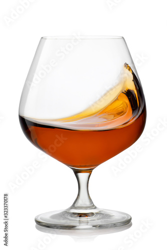 splash of brandy in snifter glass photo
