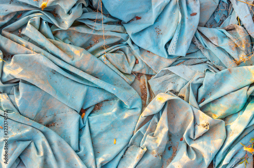 Image of blue fabric disposed of in nature