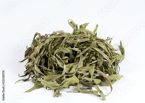 Dried plantain leaves on white background. Curative herb plantain, Plantago lanceolata,   good against the cough