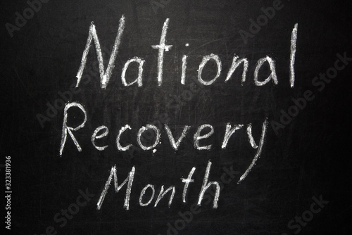 National Recovery Month written in white chalk on a black chalkboard