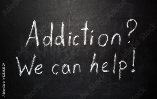 Addiction? We can Help! message on blackboard, health concept background