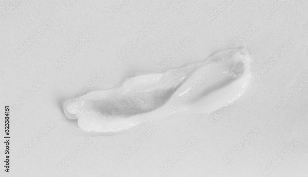 Obraz premium close up of white cream sample on white background