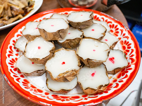 Dessert name is khanom kheng In the auspiciousness of Thai people of Chinese descent in Thailand,Put on the tray color red white photo