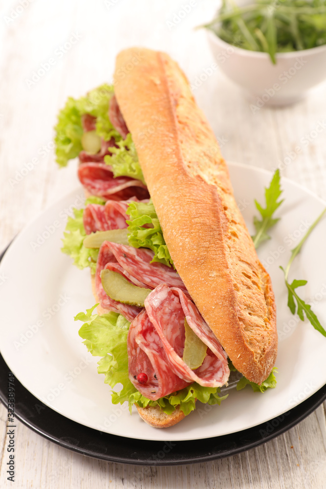 sandwich- baguette with salami, gherkin and lettuce sandwich- baguette with salami, gherkin and lettuce