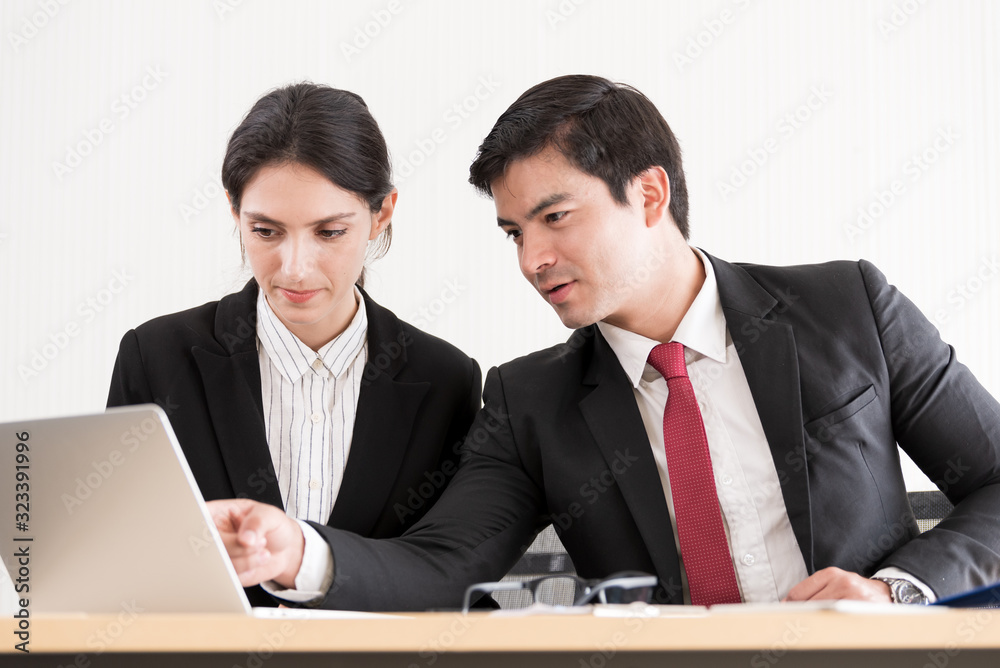 A manager and secretary working together in the office. A manager and secretary working together in the office.
