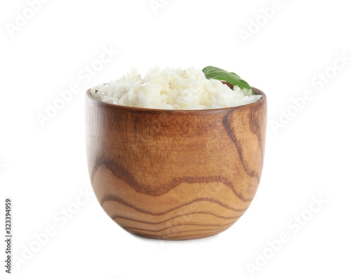 Wooden bowl with cooked rice and parsley isolated on white