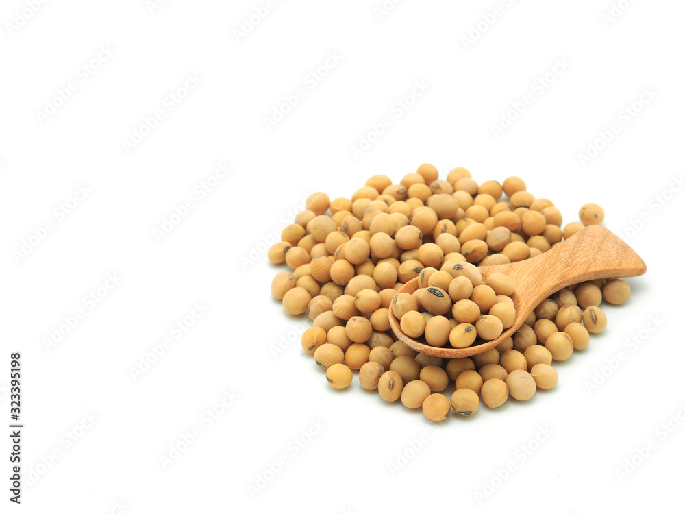 Soybeans in wooden spoon on pile isolated on white background. Soybeans in wooden spoon on pile isolated on white background.