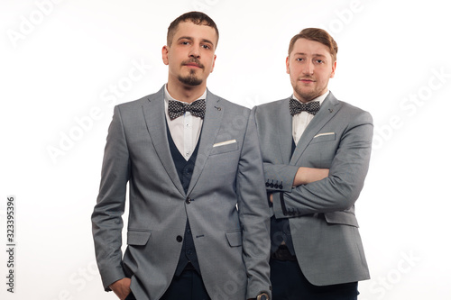 Two young funny men in formal clothes