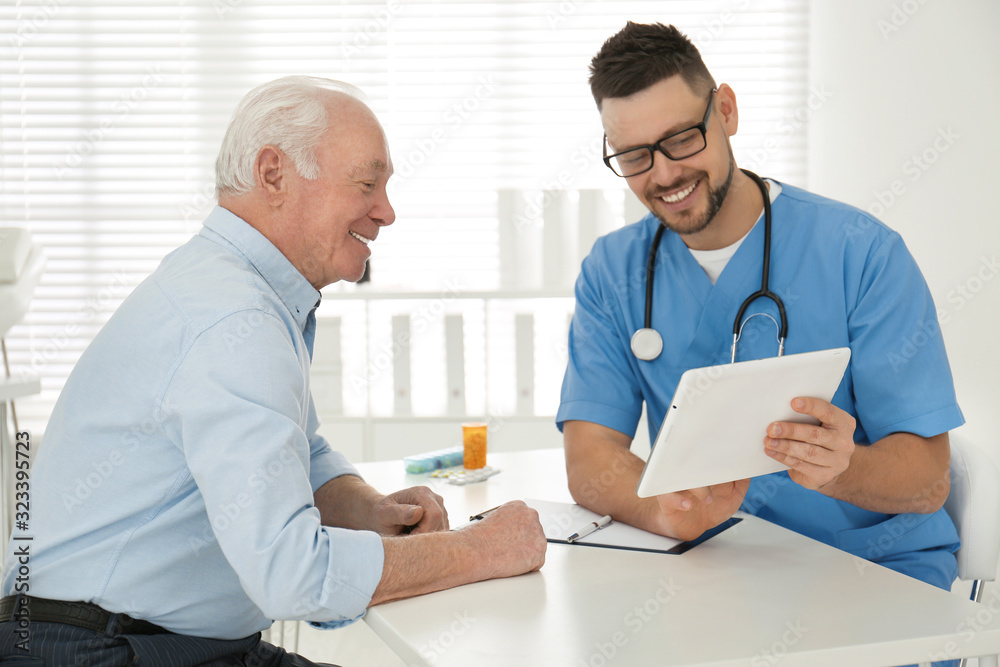 Senior man visiting doctor in modern office