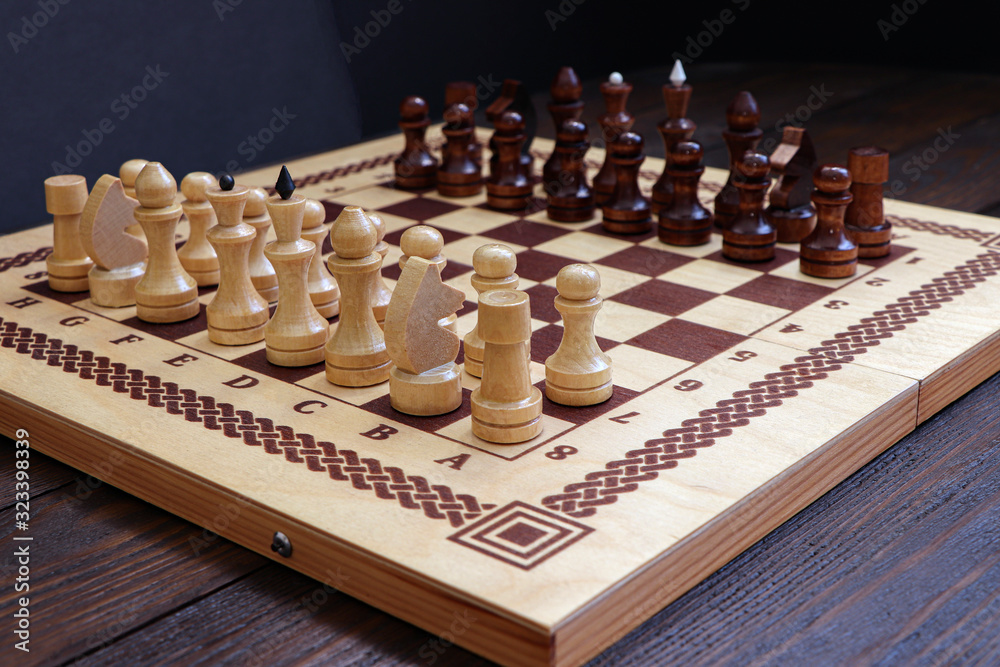 Chess game on a wooden background. Chess match. Chess game on a wooden background. Chess match.