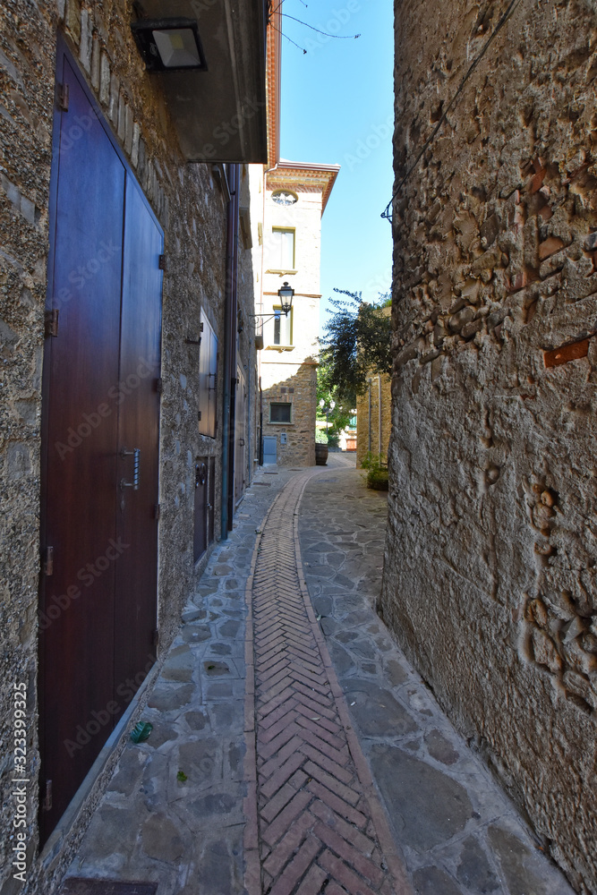 Acciaroli, Italy, 02/15/2020. A narrow street between the old houses of a village in southern Italy