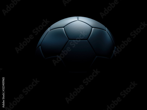 Fotografia Black football or soccer ball against black background