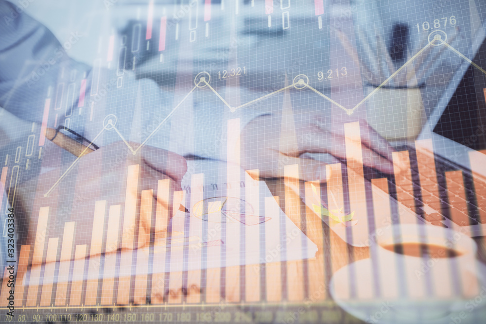Multi exposure of stock market graph with man working on laptop on background. Concept of financial analysis. Multi exposure of stock market graph with man working on laptop on background. Concept of financial analysis.