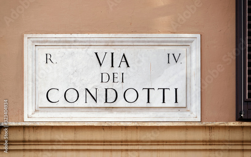 Photography Via dei Condotti street sign on wall in Rome