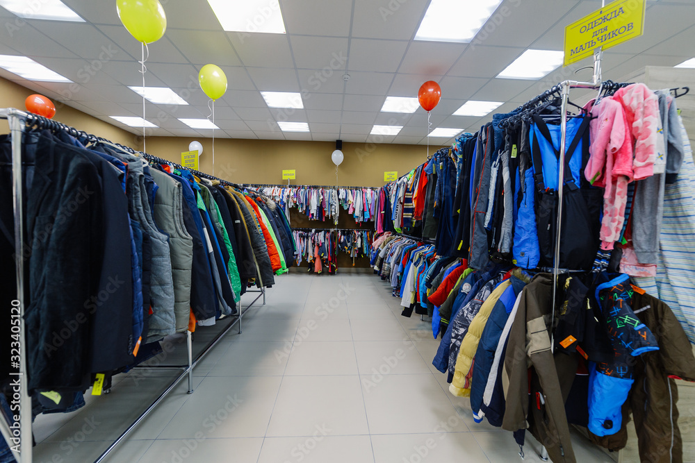 Shop interior with clothes hanging on a hanger.
