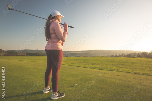 Professional woman golf player on the golf ground ready for playing golf, sport concept