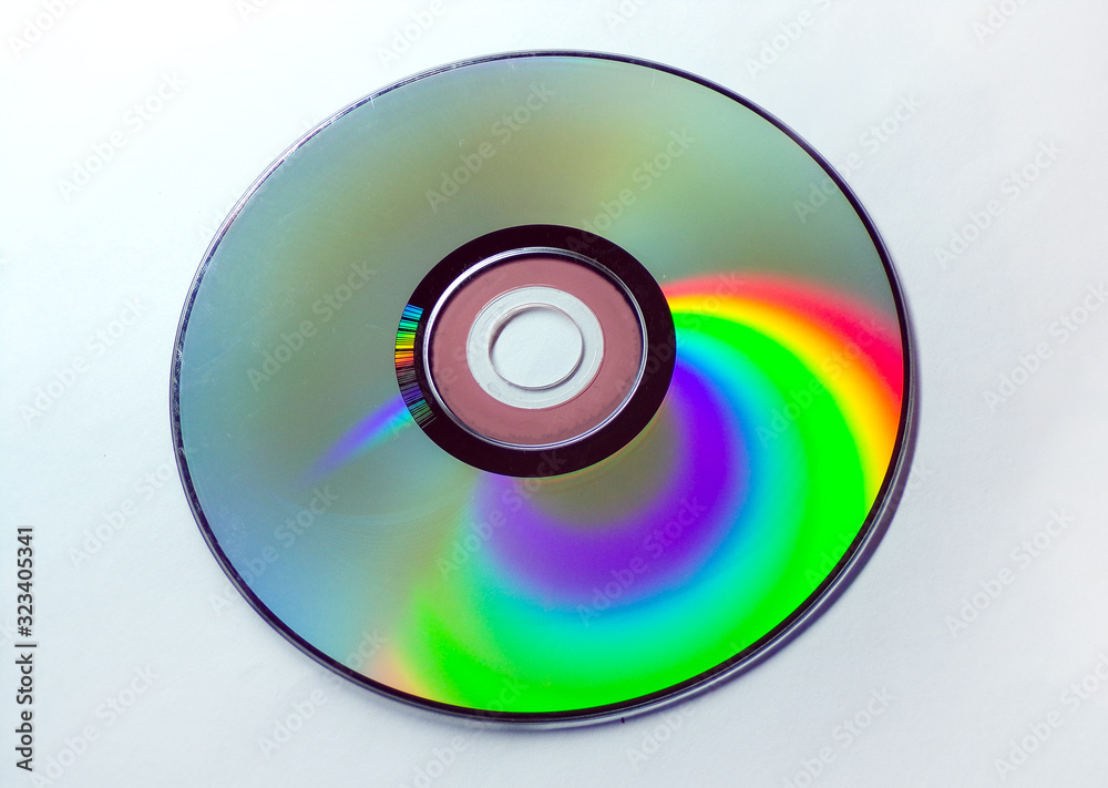 DVD CD is shimmering isolated on a white background. DVD CD is shimmering isolated on a white background.