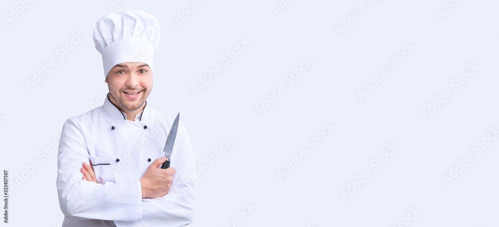 Professional Chef Holding Knife Posing On White Background, Panorama Professional Chef Holding Knife Posing On White Background, Panorama