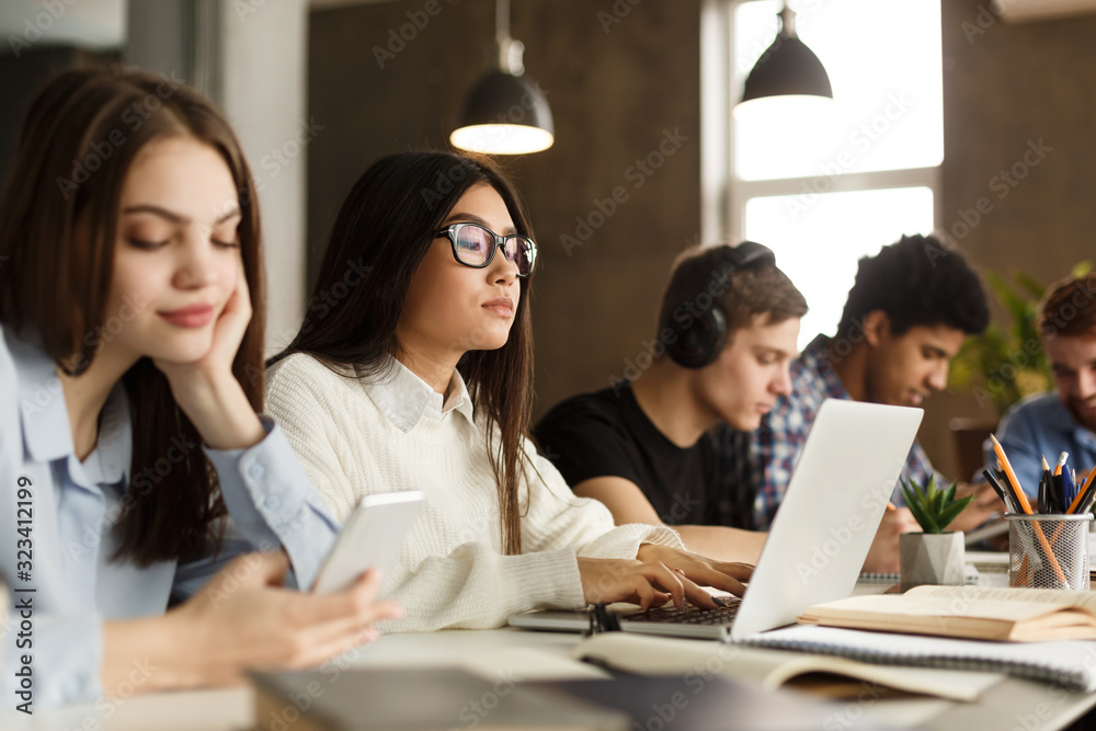 Education concept. Student girl studying in library interior Education concept. Student girl studying in library interior