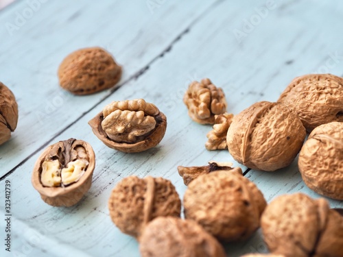 walnuts in basket on wooden background