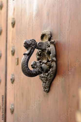 old vintage medieval iron handle door knocker
