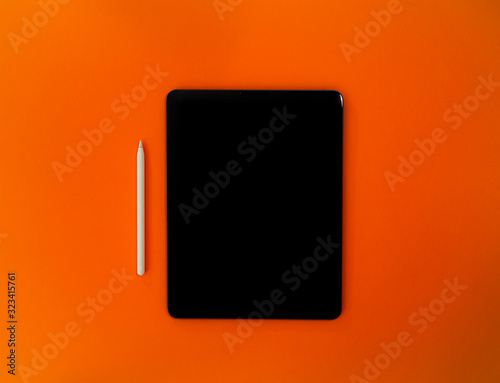 Tablet for creatives with orange background