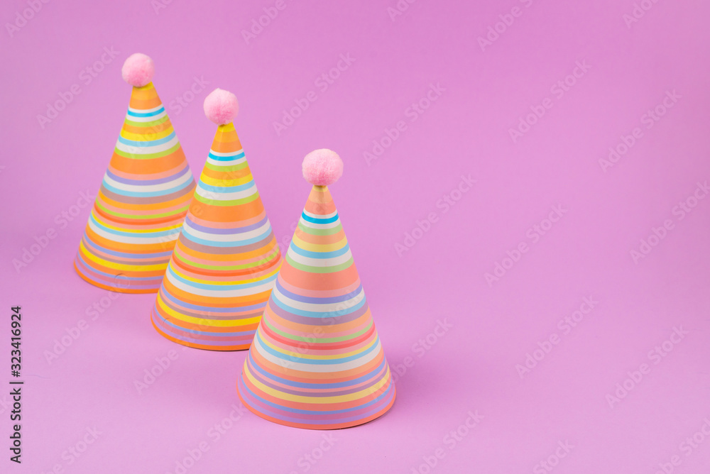 Birthday cap on pink background.