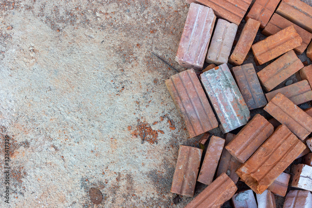 red bricks on cement floor in construction site. top view