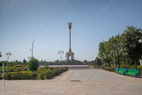 Independence Monument near Rudaki Park on a sunny day in Dushanbe, Tajikistan photo