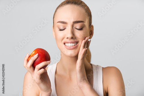Photography Young Woman Having Tooth Pain Eating Apple On Gray Background
